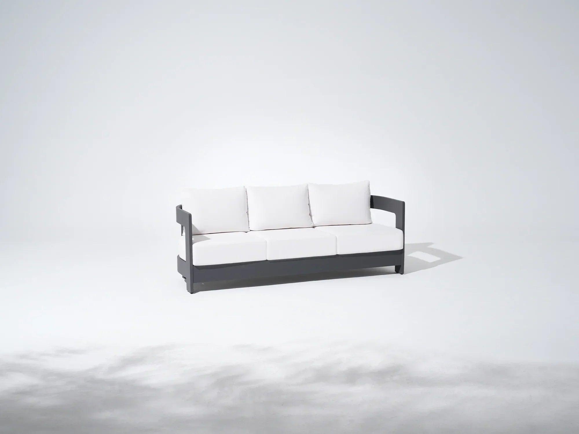 Modern outdoor 3-seat sofa with white cushions