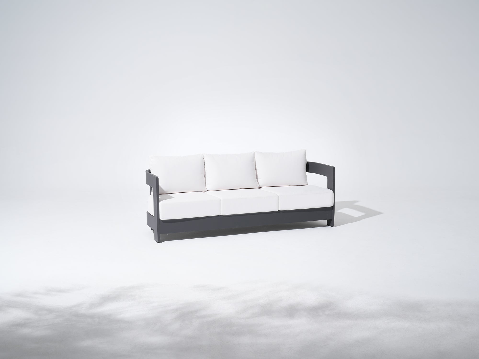 Modern outdoor 3-seat sofa with white cushions