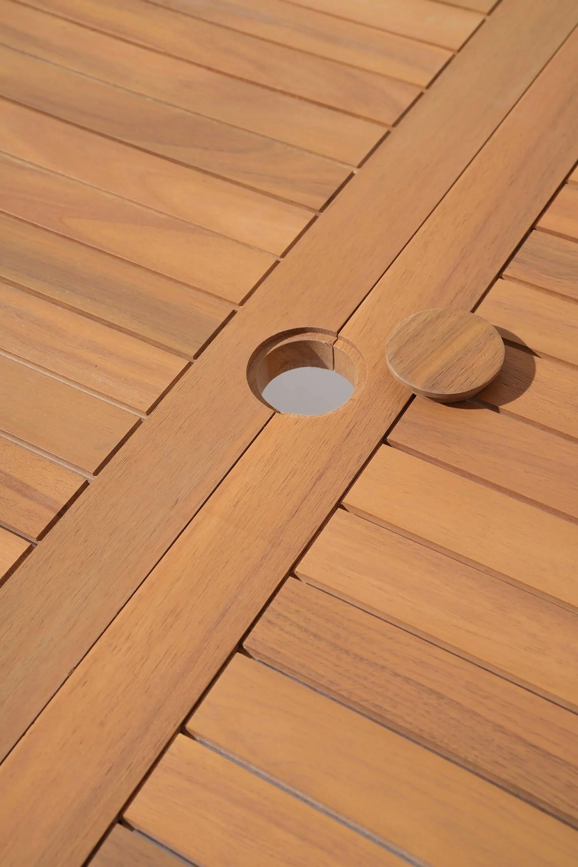 Close-up of wooden umbrella hole