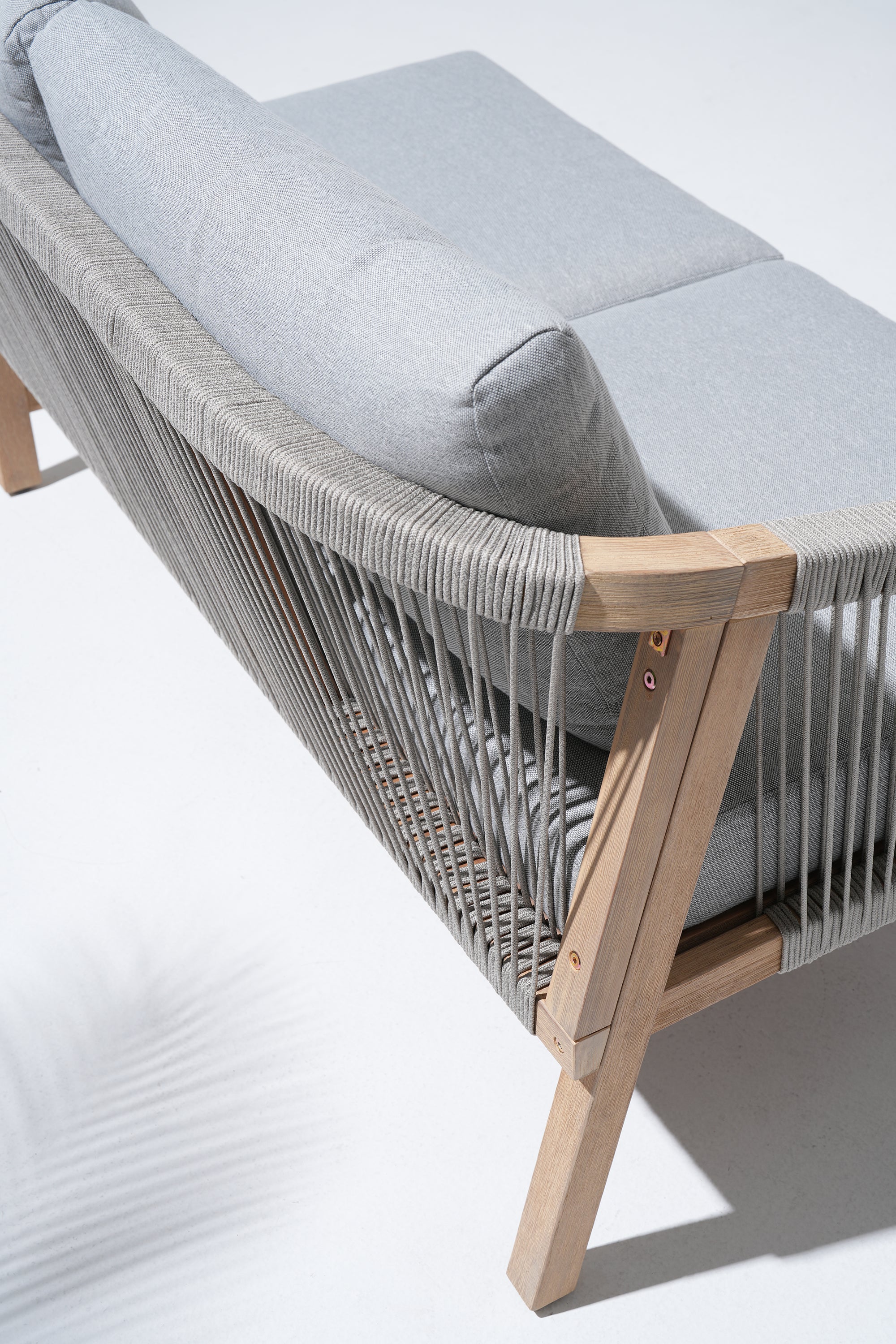 Gray cushioned rope armchair with wooden frame