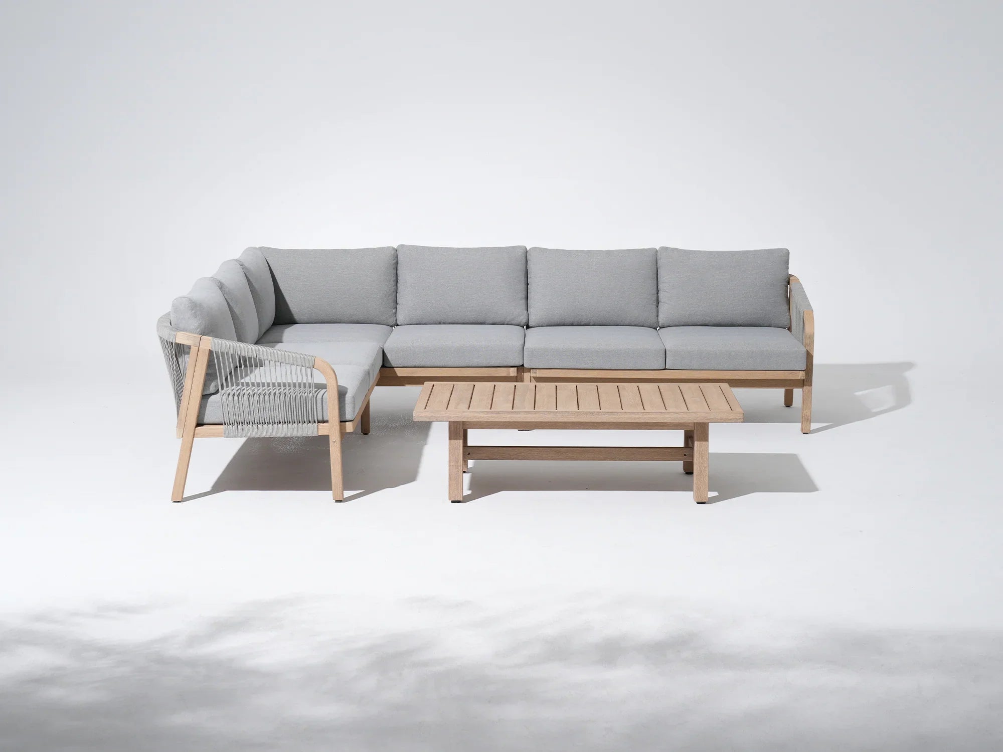 L-shaped Modern outdoor sofa set with coffee table, wooden frame and light gray cushions