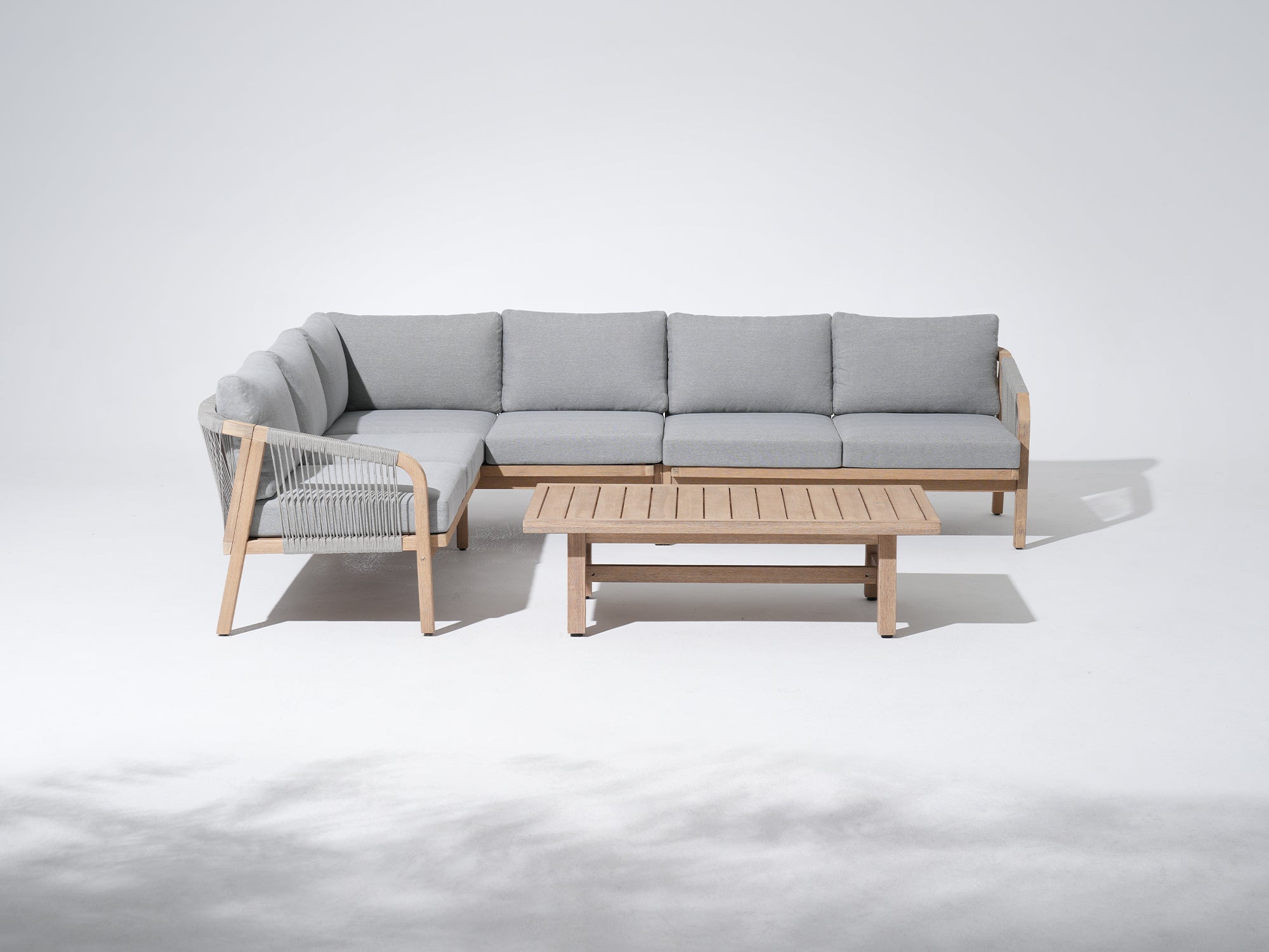 L-shaped Modern outdoor sofa set with coffee table, wooden frame and light gray cushions