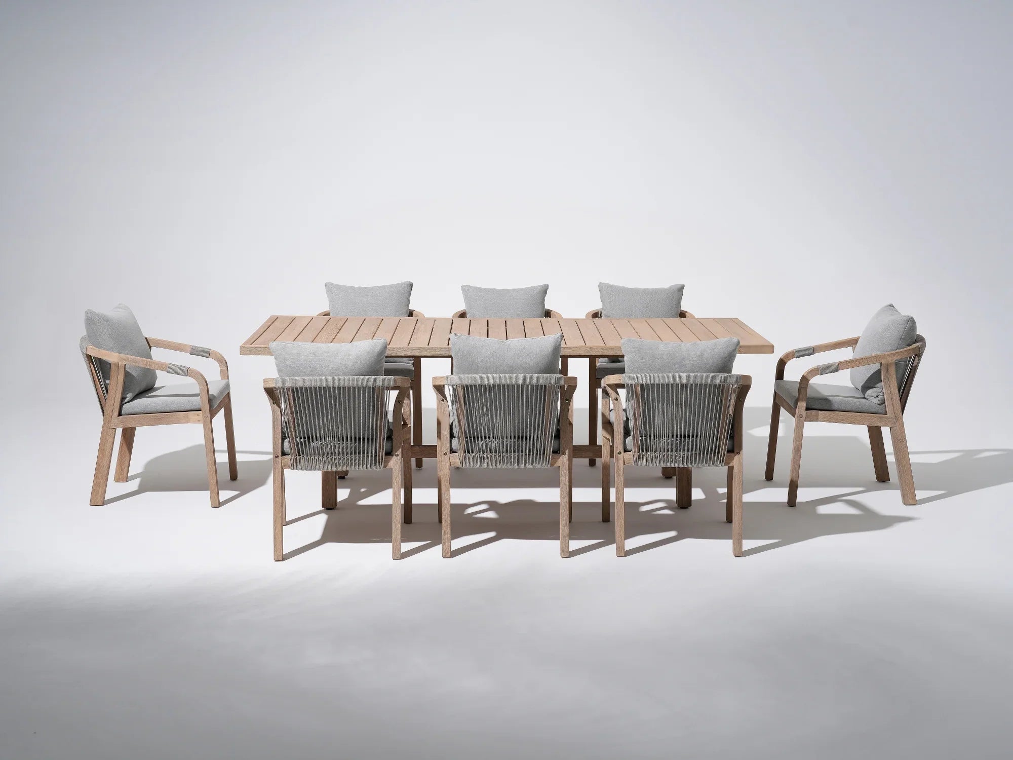 Wooden Outdoor Patio Dining Set For 8, a rectangular acacia wood outdoor dining table and 8 patio dining chairs with gray seat and back cushions, gray rope design - Jardina Premium Modern Outdoor Patio Dining Furniture Set