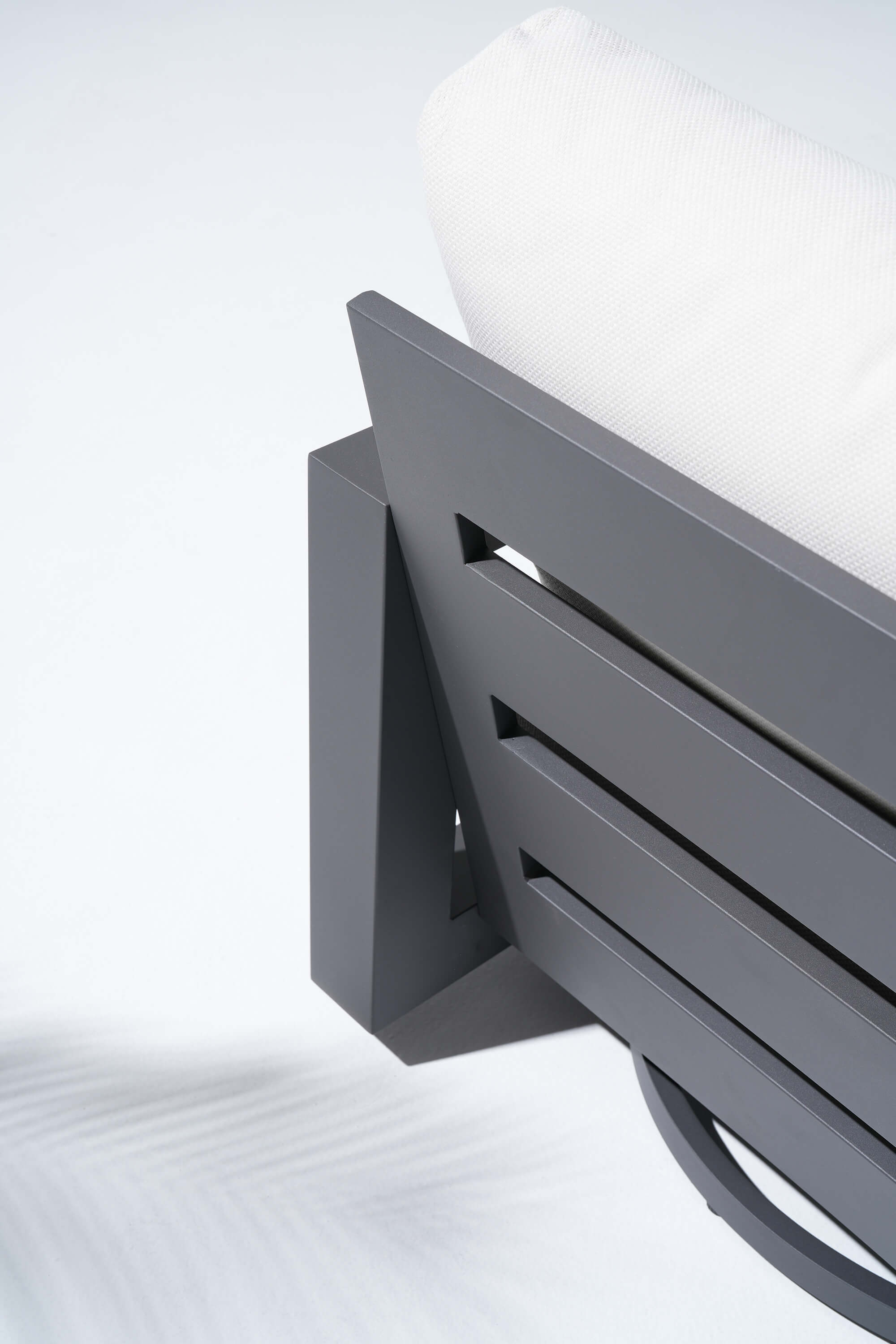 Gray metal chair with white cushion