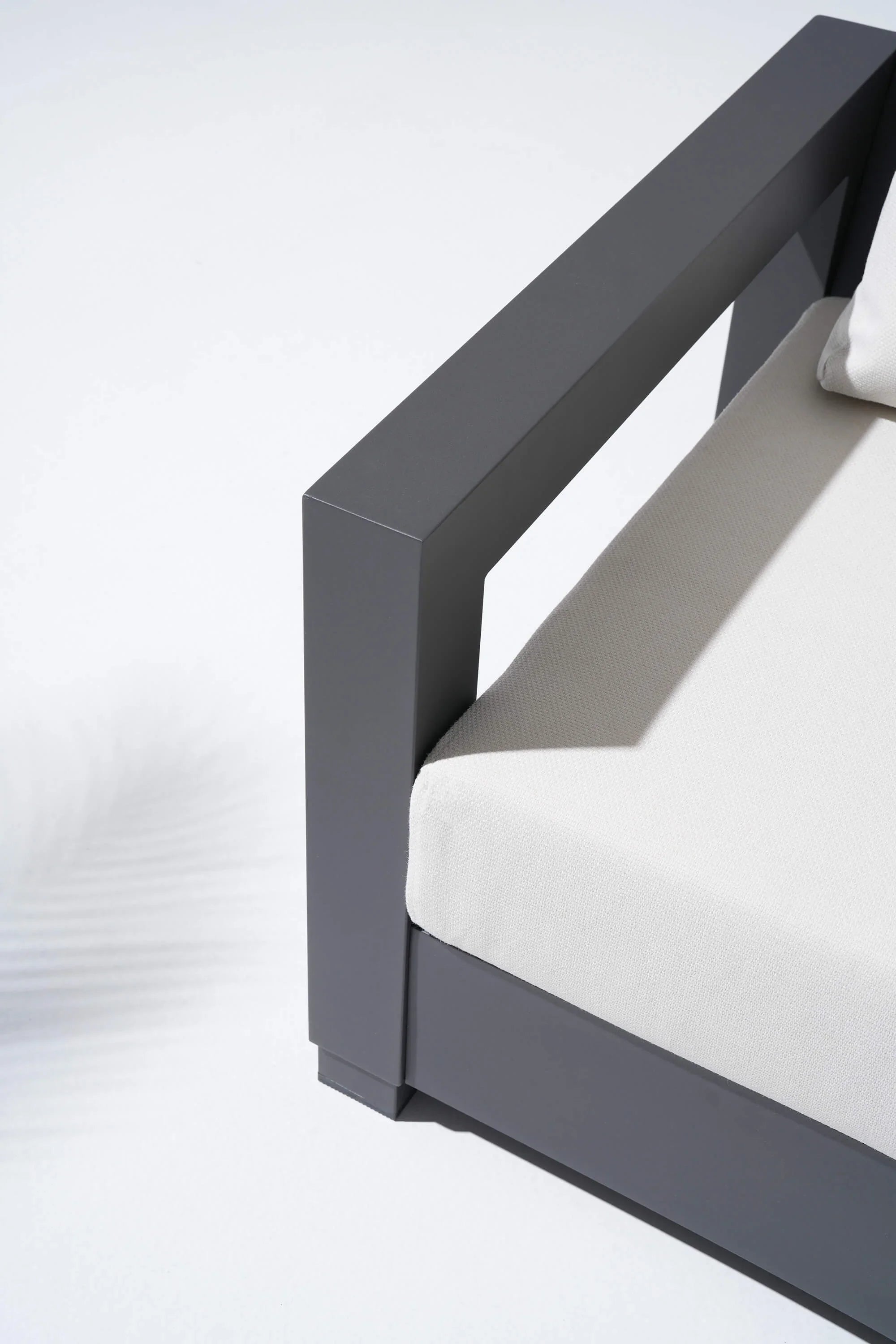 Gray metal frame with white cushion