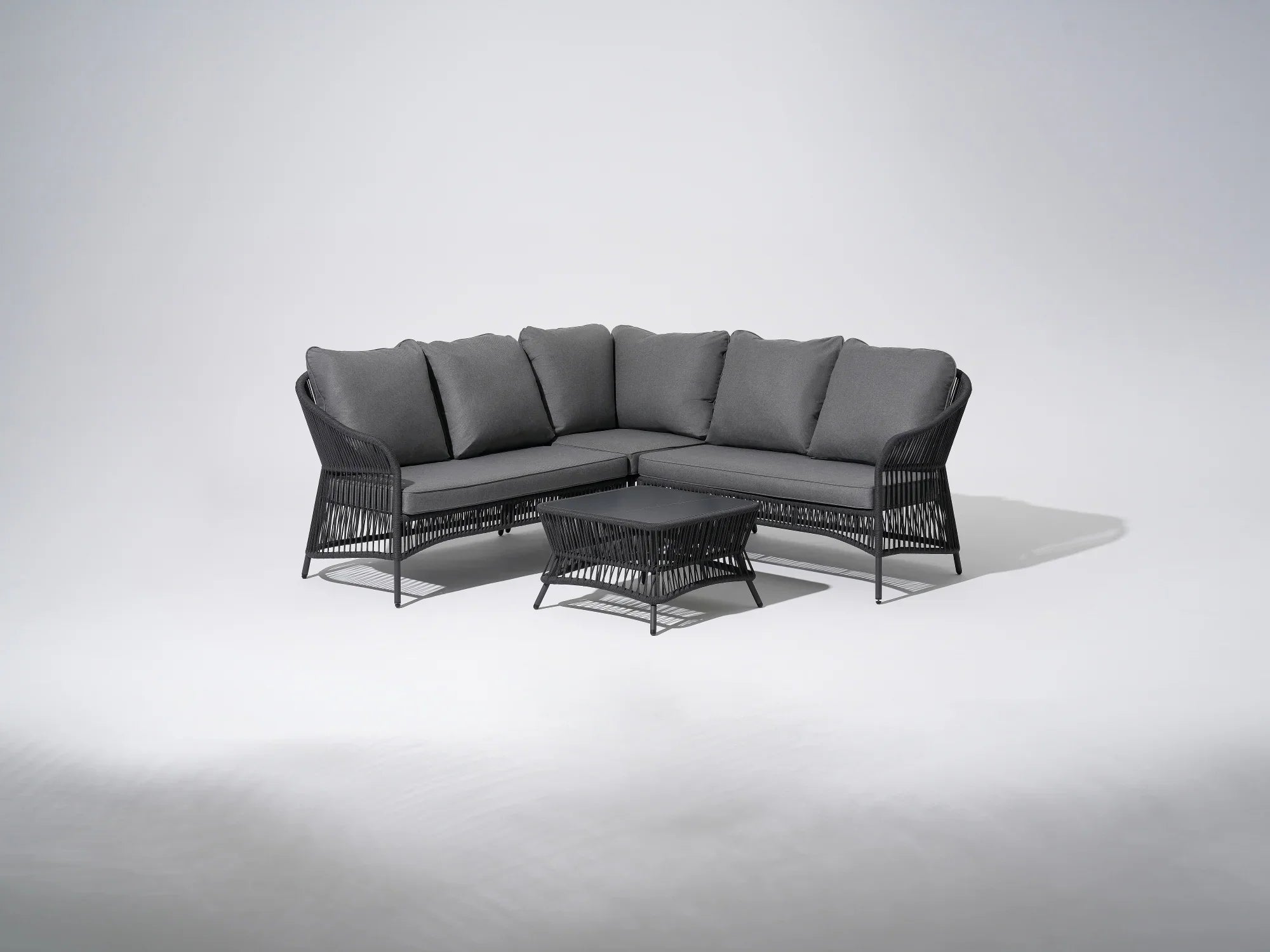 4-seat L-shaped outdoor sectionals, black Aluminum patio conversation set with black rope design and gray cushions, a square coffee table with black rope design - Jardina Premium Modern Outdoor Patio Furniture Set