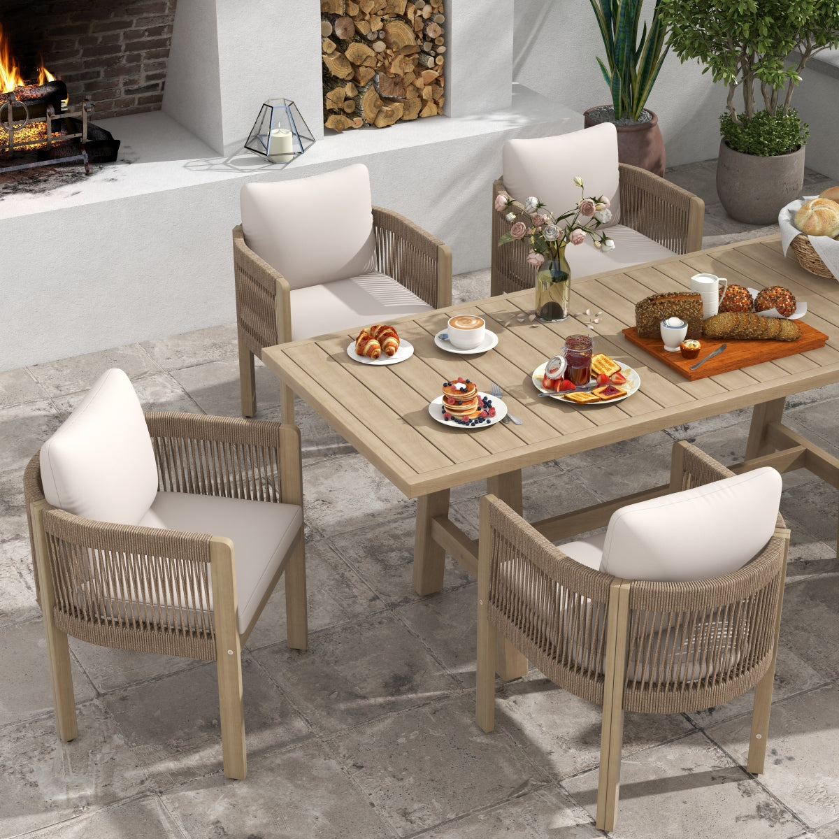 modern Outdoor dining set with table and chairs by a poolside, acacia wooden and hand woven rope design, white cushions