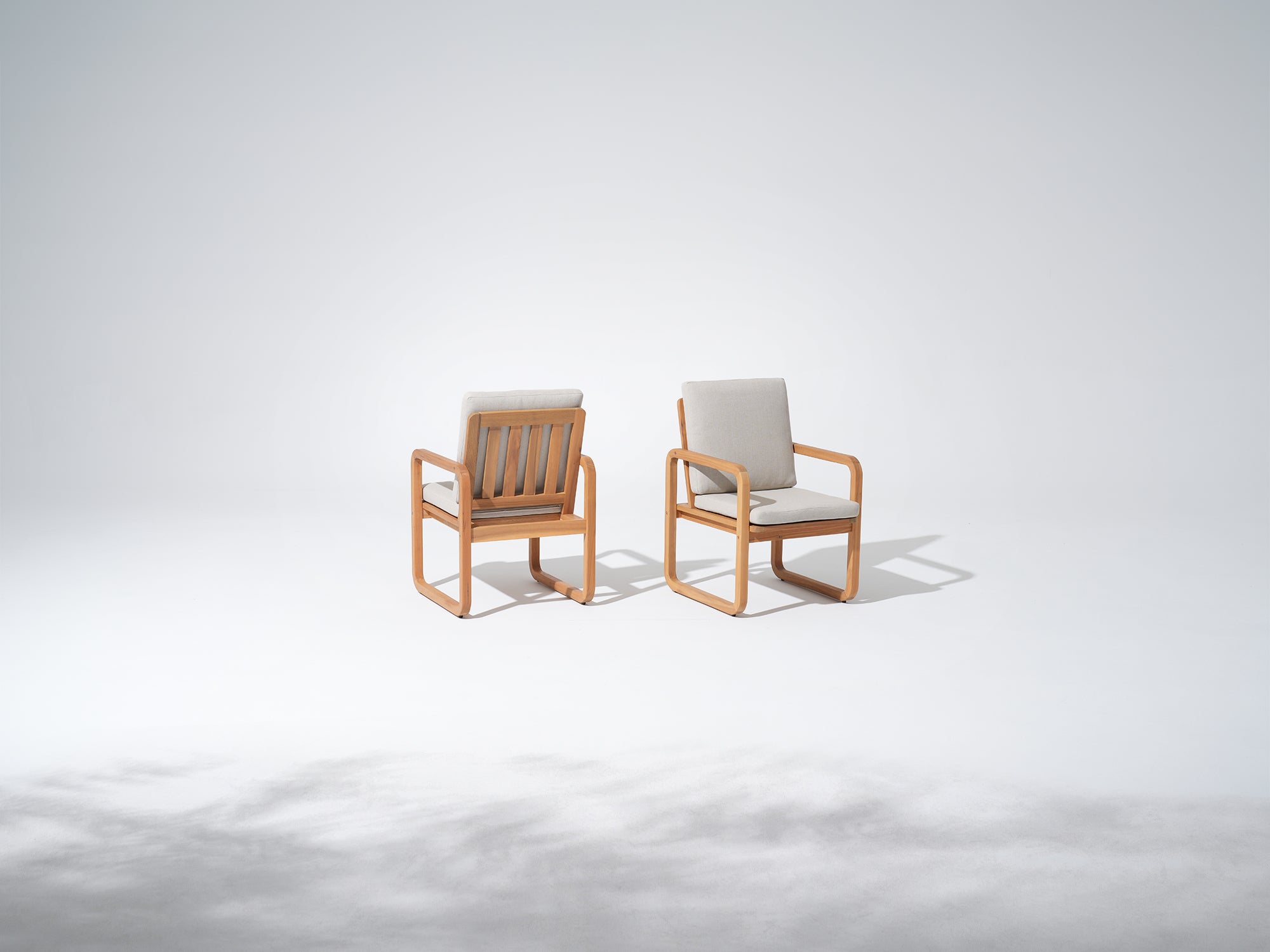 Two acacia wooden chairs with white cushions - Jardina Premium Modern Outdoor Dining Furniture
