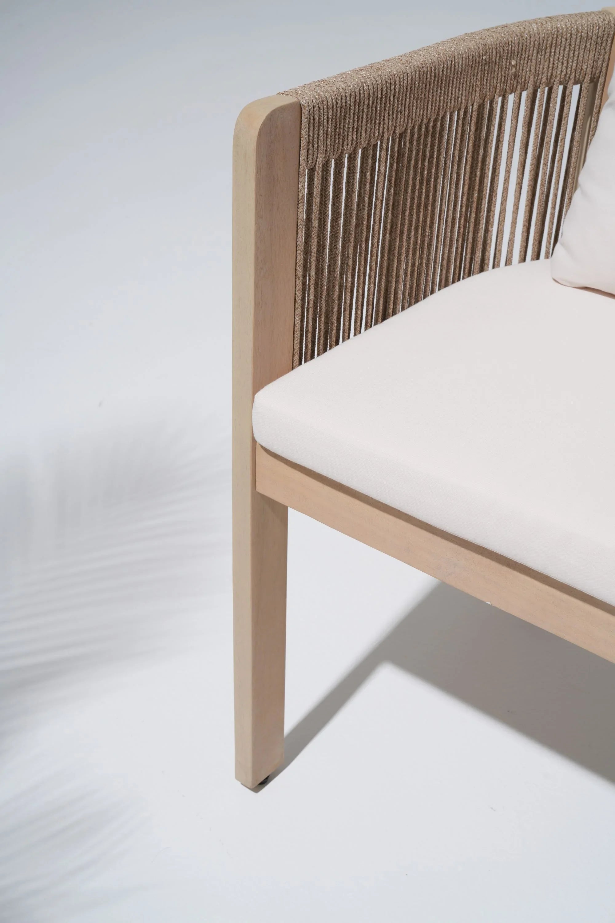 Chair with woven backrest and white cushion detail - Jardina Modern Premium Outdoor Patio Furniture