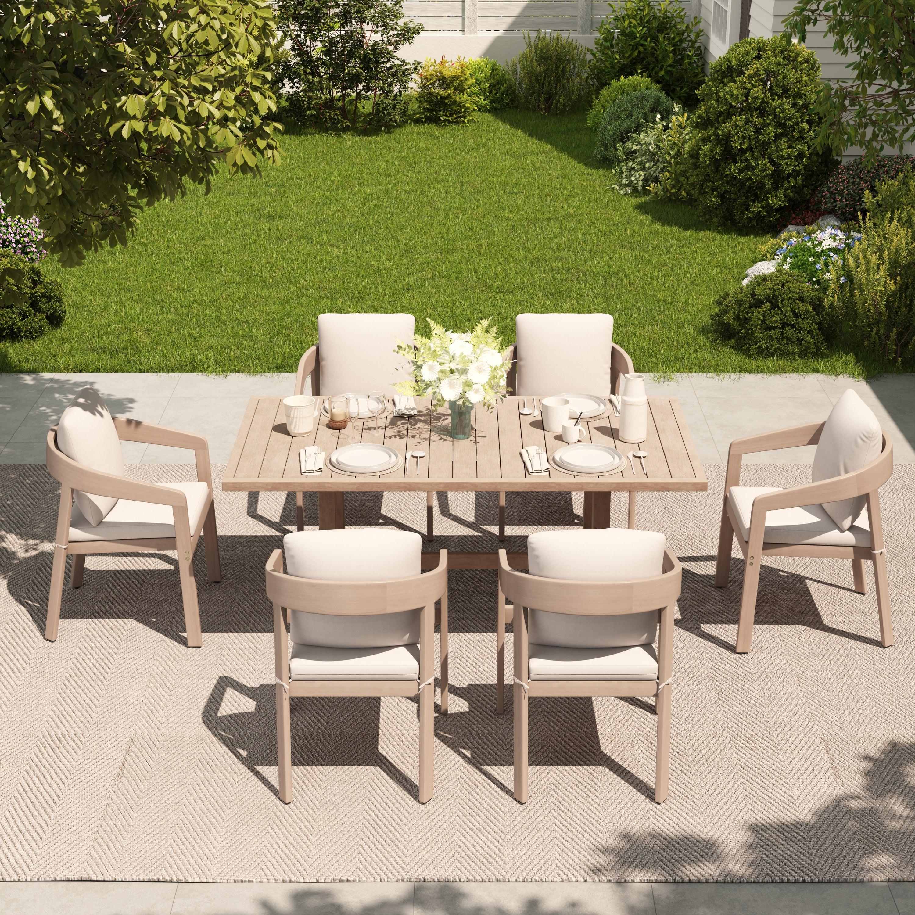 Outdoor dining set for 6 with a table and curved Eucalyptus chairs on a patio - Jardina Premium Modern Outdoor Dining Furniture
