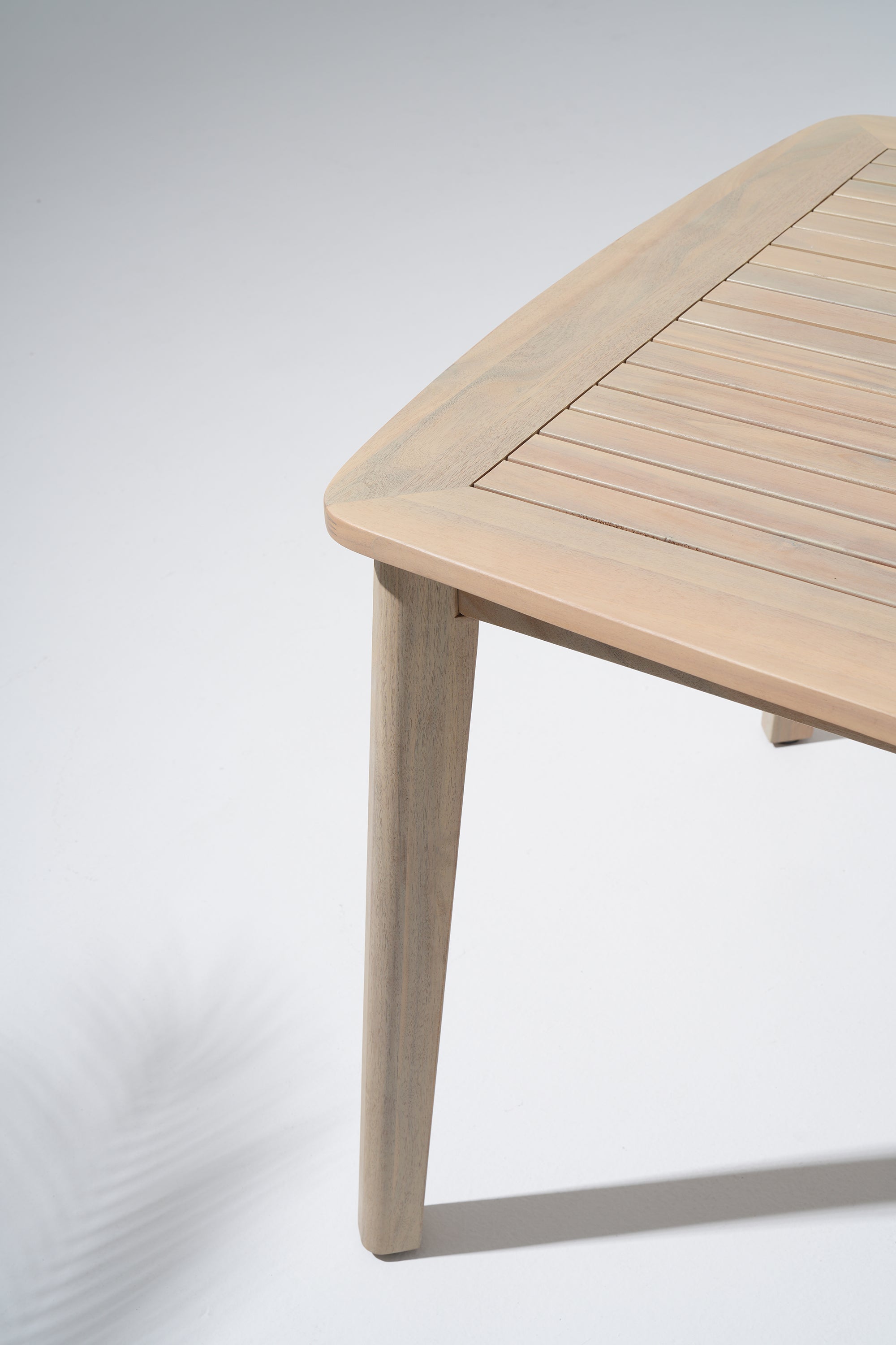 acacia Wooden dining table with a light finish