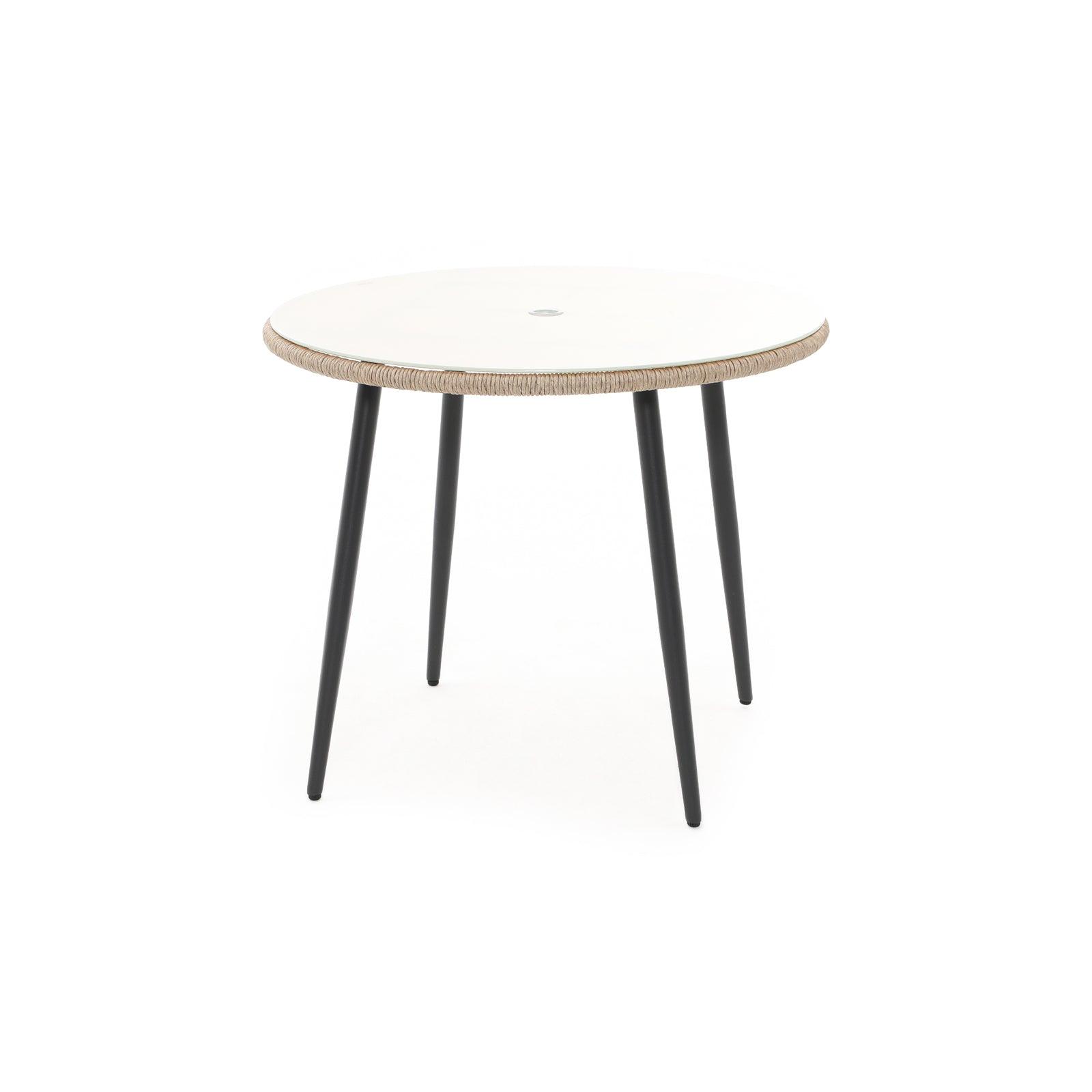 Hallerbos Round Dining Table with umbrella hole, twisted rattan design, steel frame, glass top, front view - Jardina Furniture #Color_Natural