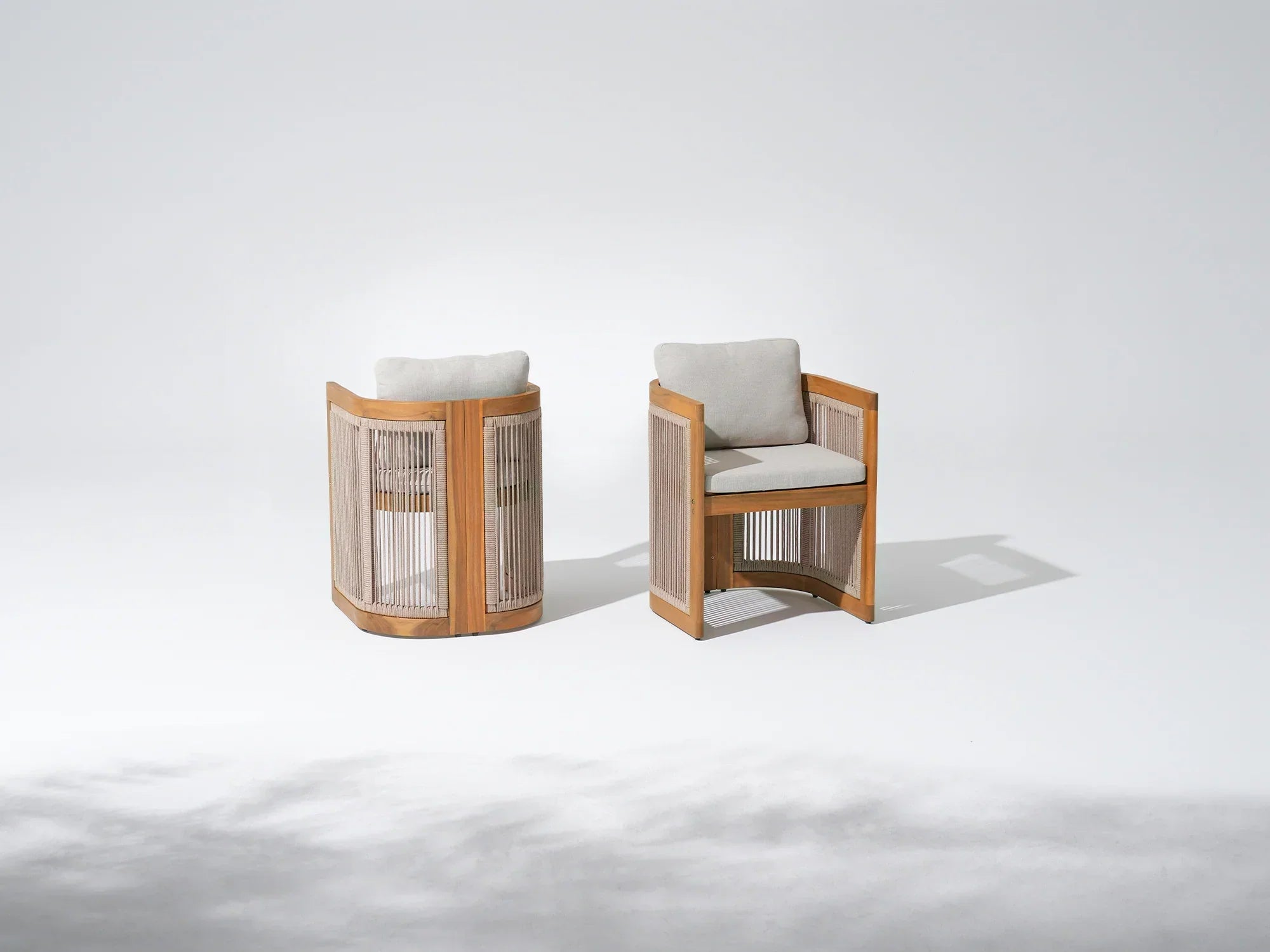 Two modern dining chairs with acacia wooden frames, rope design and light grey cushions - Jardina Premium Modern Outdoor Dining Furniture