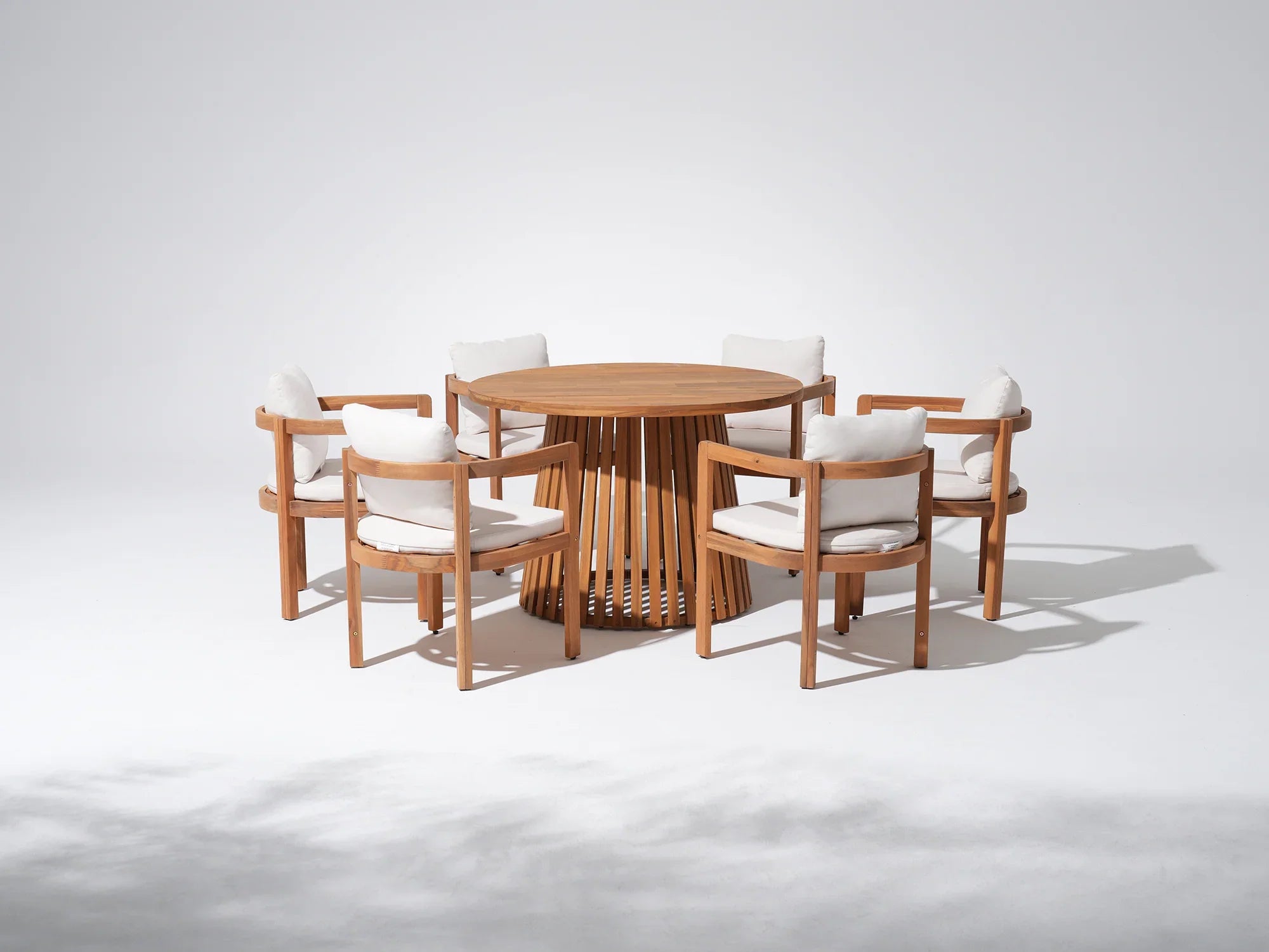 Round acacia Wooden dining table with six chairs for 6 people, white cushions - Jardina Premium Modern Outdoor Dining Furniture