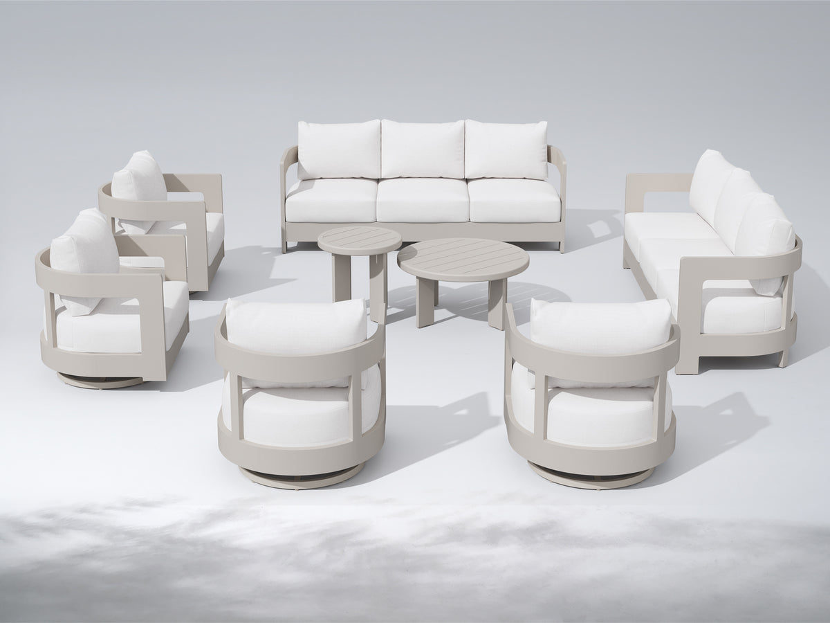 A modern outdoor patio furniture set arranged in a semi-circle, featuring a three-seat sofa, two loveseats, two swivel armchairs, and two round nesting coffee tables. The furniture has light gray frames and off-white cushions, set against a clean, light gray studio background. #color_white