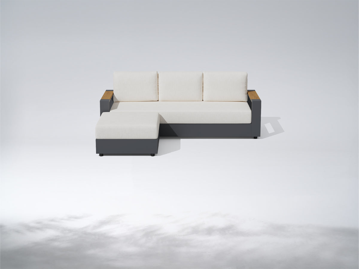 A modern outdoor sectional sofa with a left-facing chaise, featuring off-white cushions, a dark gray frame, and light brown wood armrests, shown on a light gray studio background. #config_3-Seat Chaise