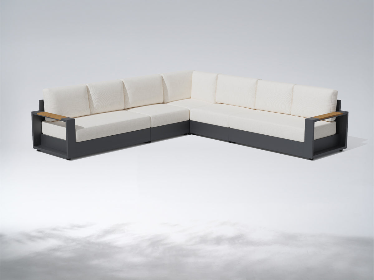 An L-shaped outdoor sectional sofa with cream-colored cushions and a dark gray frame, featuring light wood armrests, shown on a light gray studio background. #config_7-Seat L‑Corner