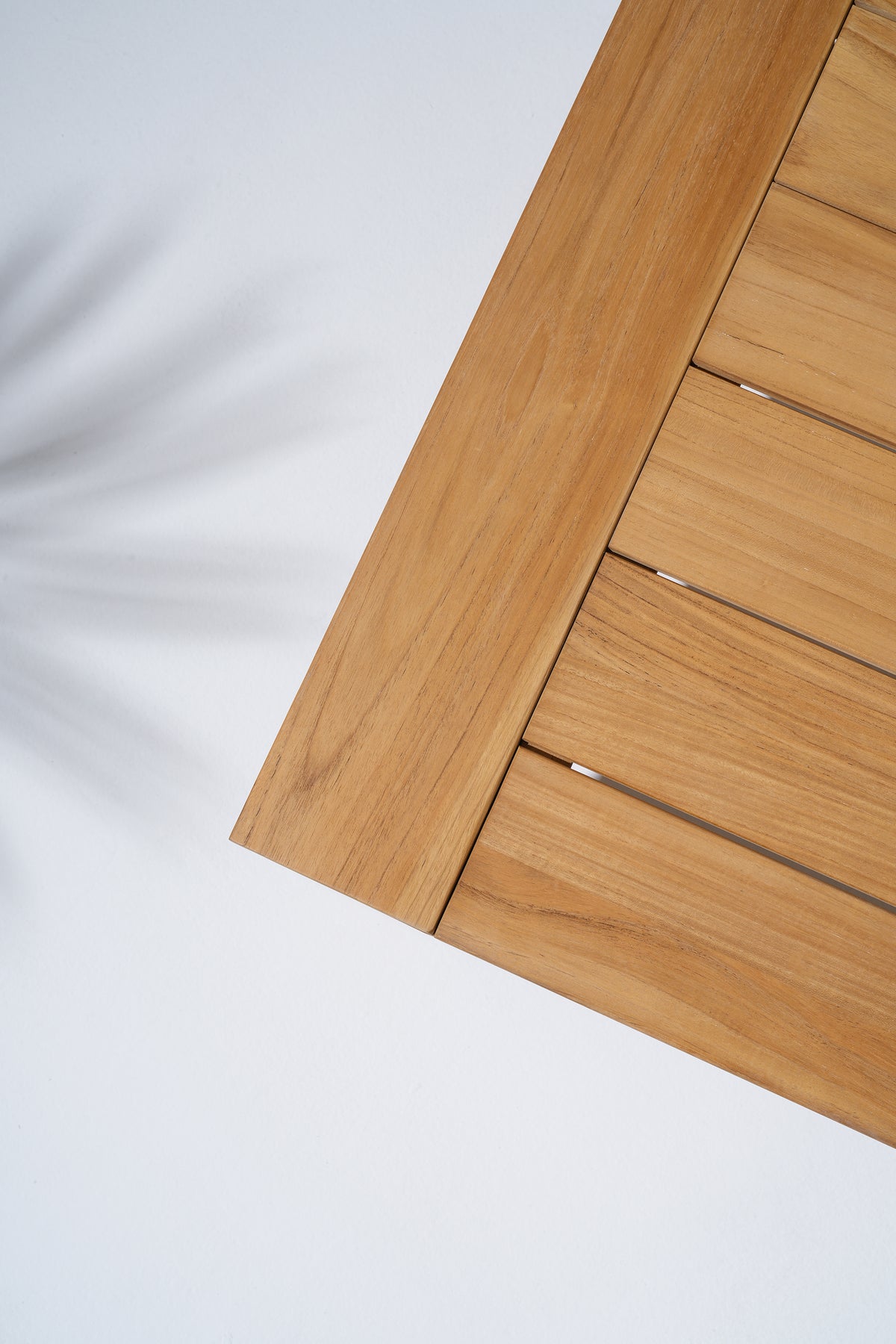 close-up of Braga teak wood coffee tabletop with slatted design- Jardina
