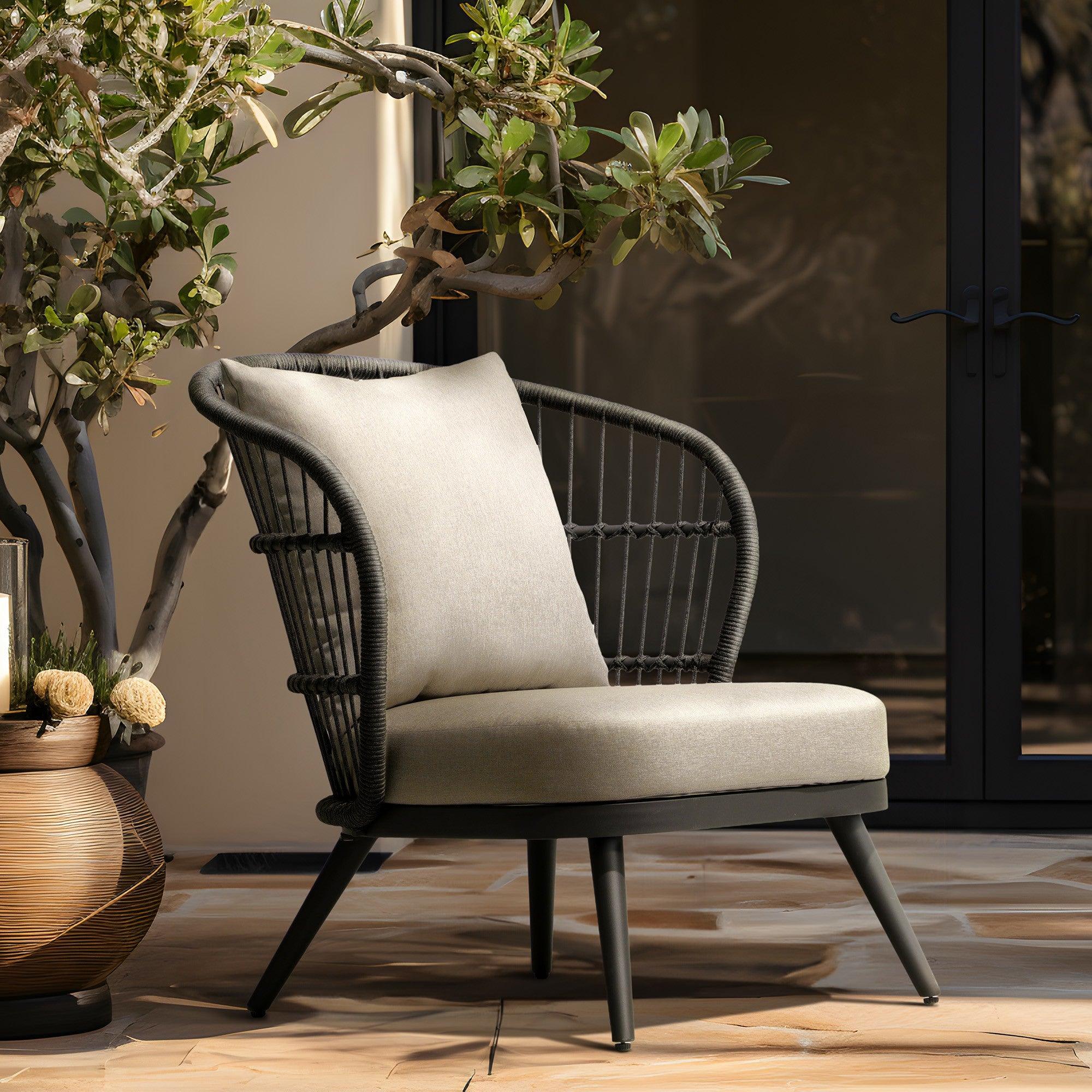 Comino Modern Rope Outdoor Furniture, dark grey aluminum frame lounge chair with backrest rope design and light grey cushions, in the garden- Jardina Furniture