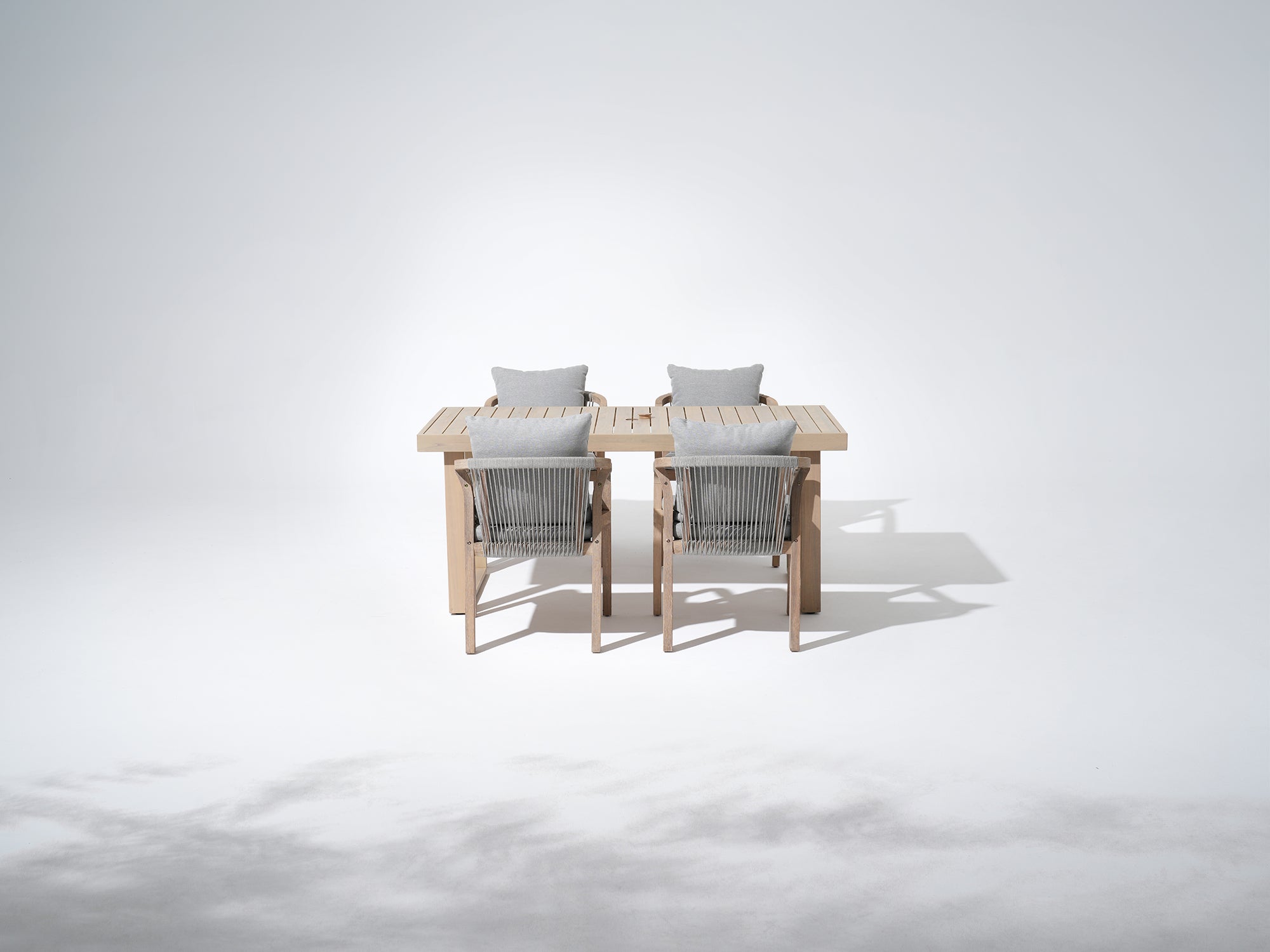 Thalea rectangular wood outdoor dining set for 4 people,  a 67'' table with umbrella hole and four wood armchairs with rope design