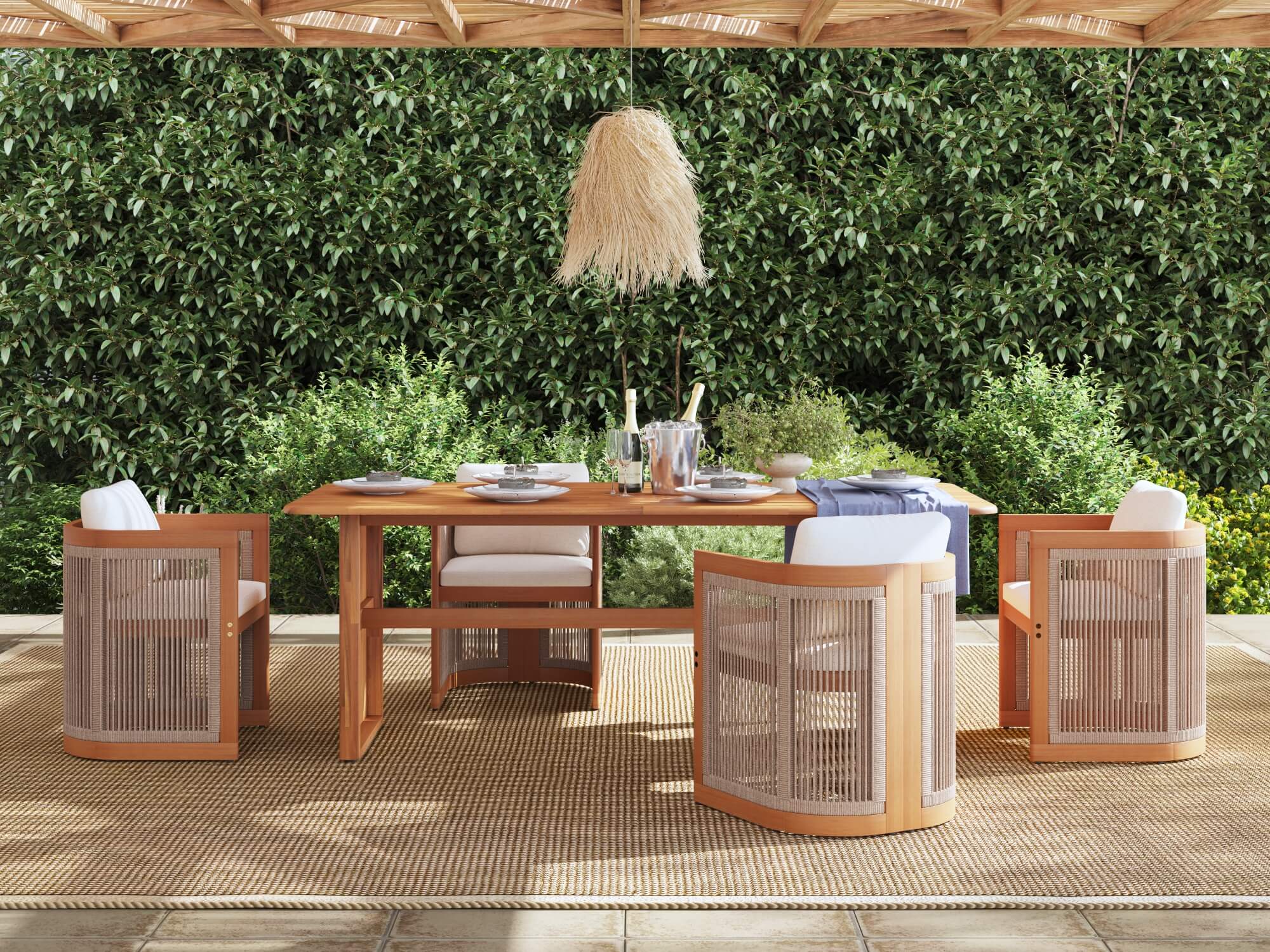 Outdoor dining set for 4 with wooden table and chairs on a patio with greenery in the background- Jardina Modern Premium Patio Outdoor Furniture 