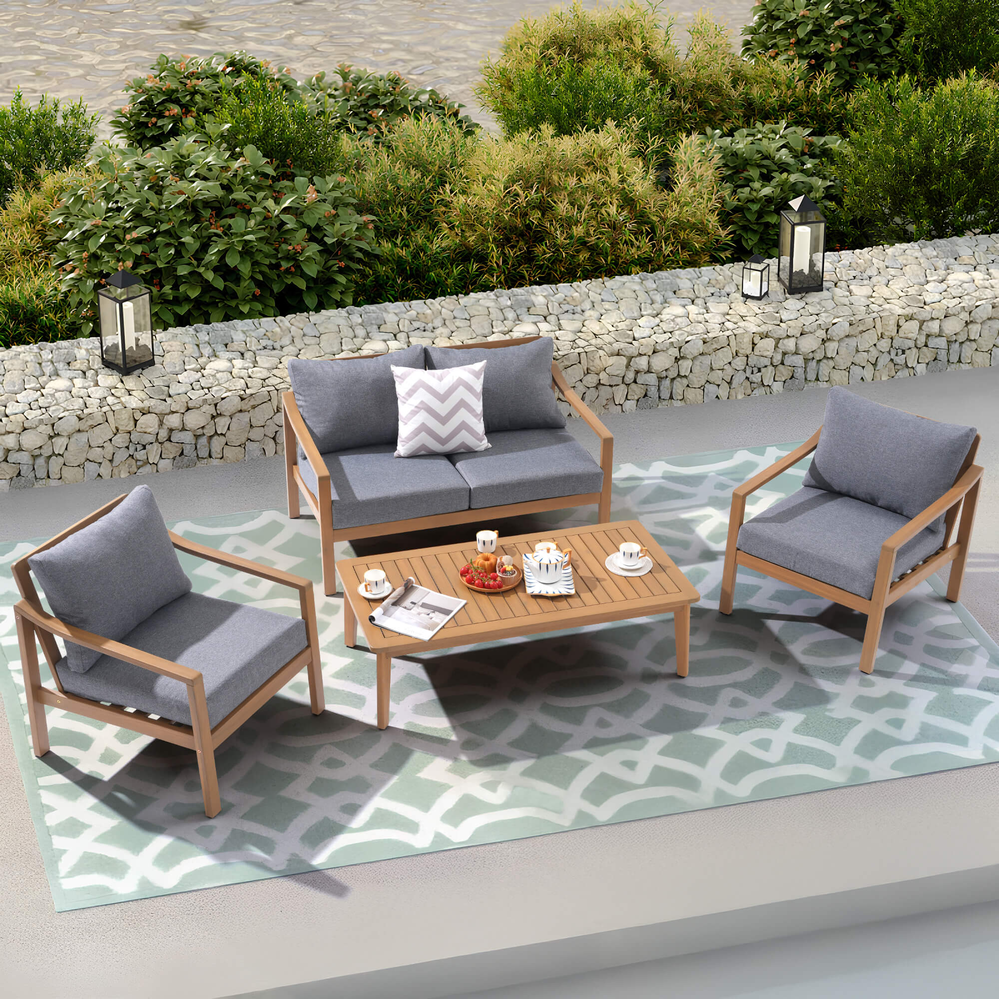 Noto gray Outdoor conversation furniture set with wooden chairs and table on a patterned rug- Jardina Modern Premium Patio Outdoor Furniture