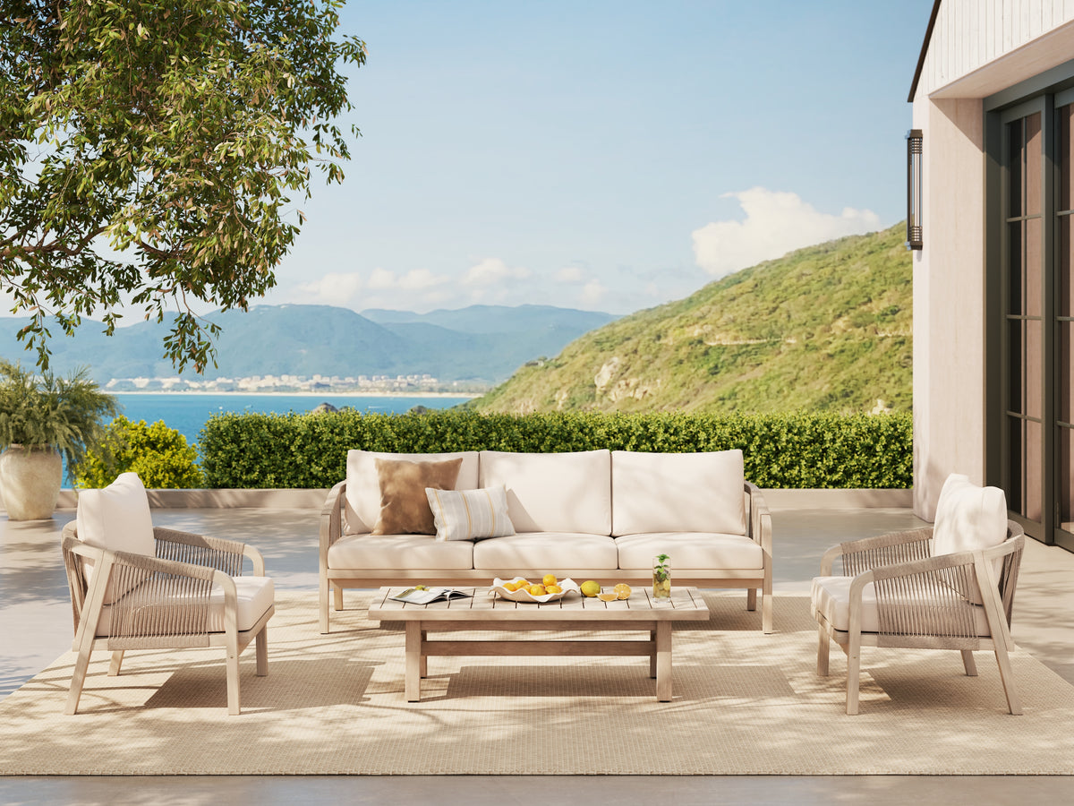 4-pc wood and rope Outdoor patio furniture set with a beige sofa, two matching armchairs, and a rectangular coffee table on a woven rug- Jardina premium modern outdoor patio furniture