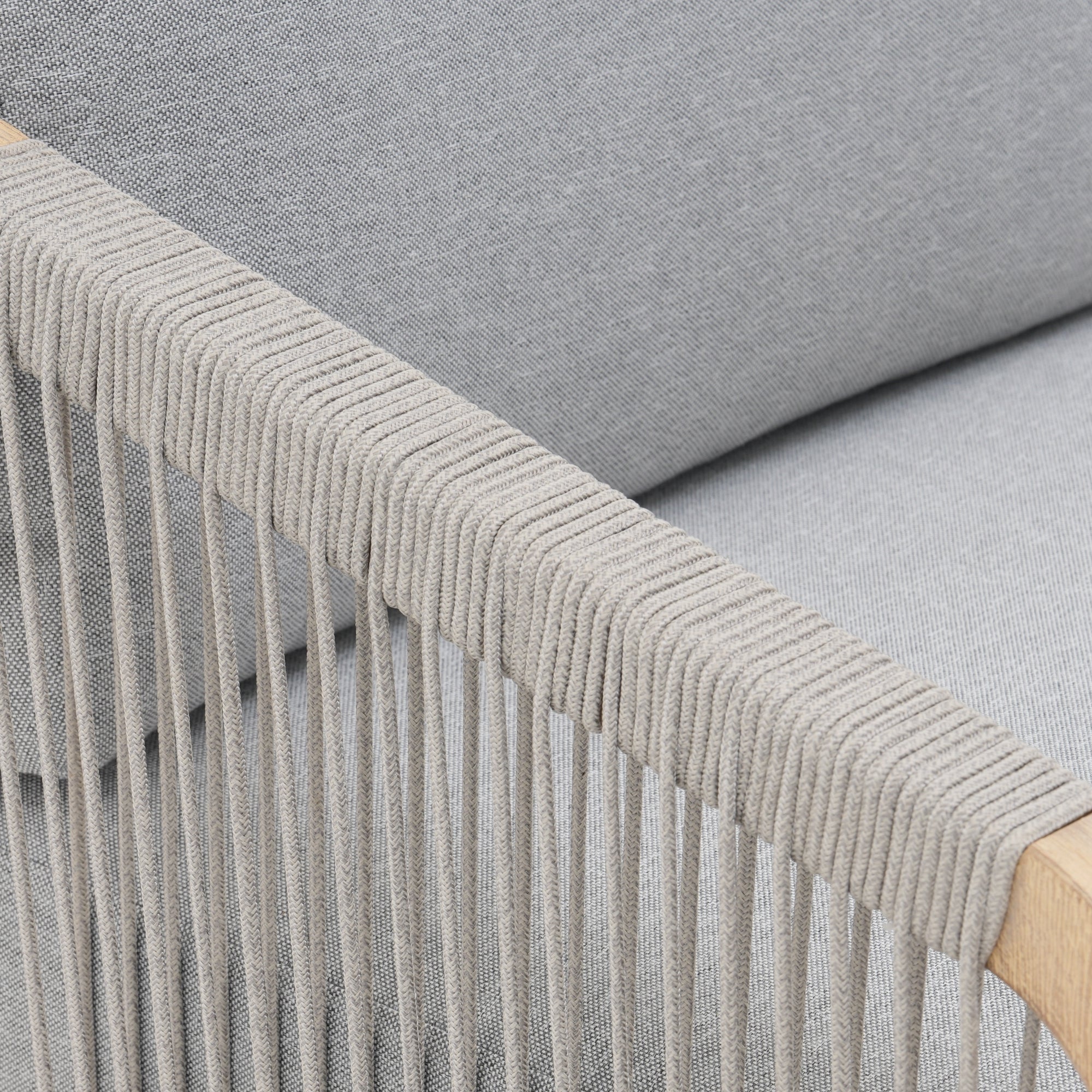Gray textured fabric with rope armrest